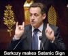 Sarkozysatanichandsign.jpg